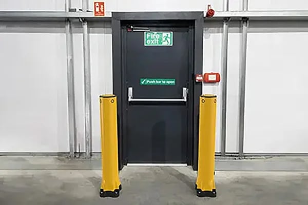 safety bollards protect emergency exit area