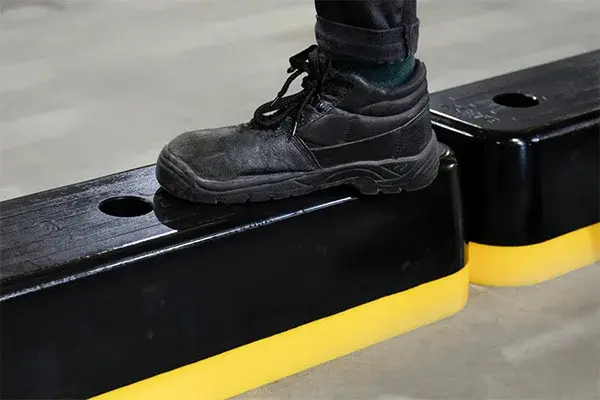 a-safe step guard safety curb being stepped upon