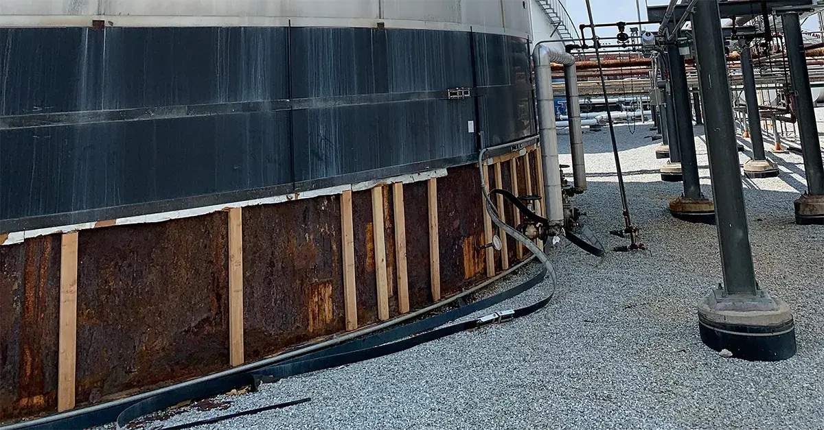 corrosion under insulation is revealed along the base of this storage tank