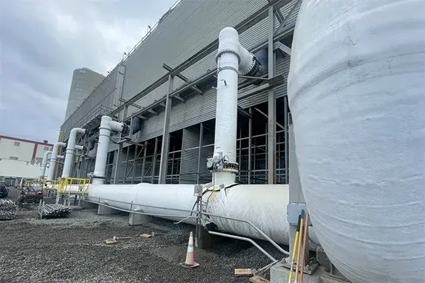 large cooling tower at new jersey power generating station shown with broken beetle pipe